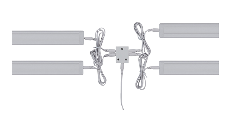 A 4-way splitter sits in the middle and 4 LED lights are plugged into it.